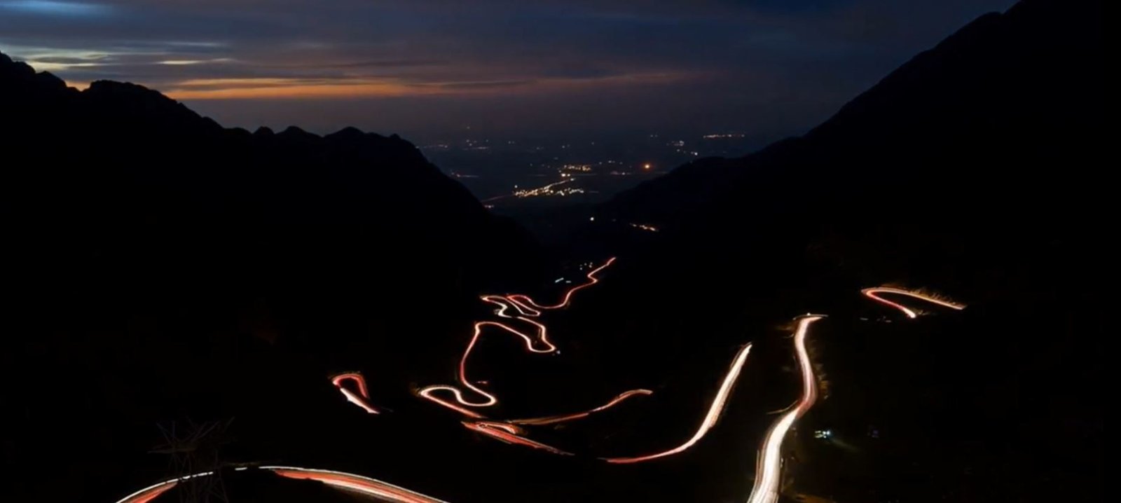A winding mountain road at night